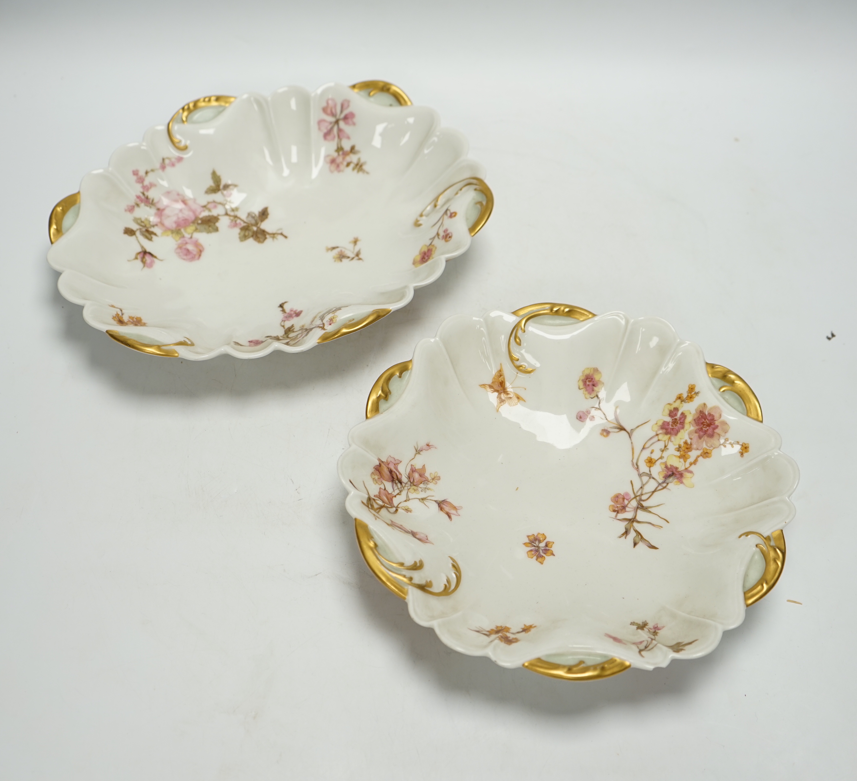 A Limoges eight piece dessert service with gilt decoration, 26cm wide